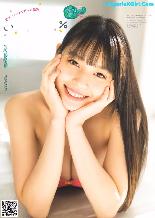 A woman in a pink bikini posing for a magazine cover.